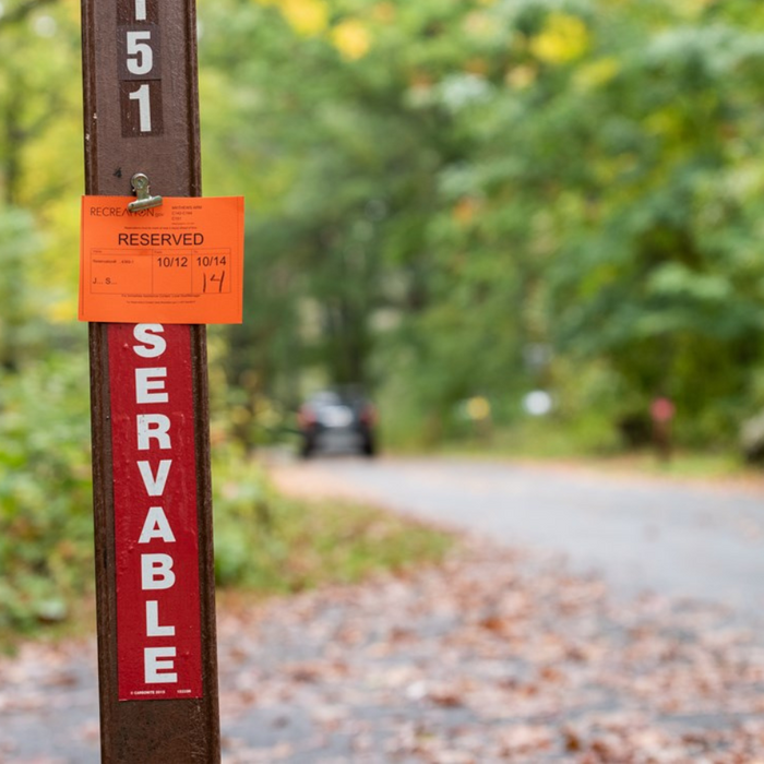 Campsite reservation sign